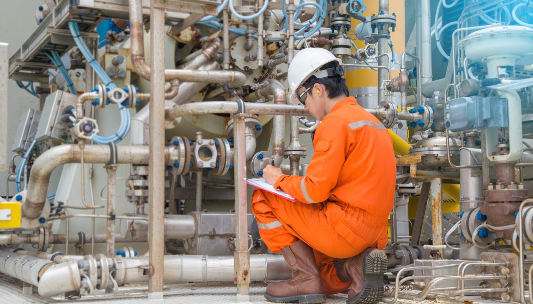 Mechanical inspector inspection on gas turbine compressor to find an abnormal condition while compressor is running. Offshore oil and gas industry maintenance activities.